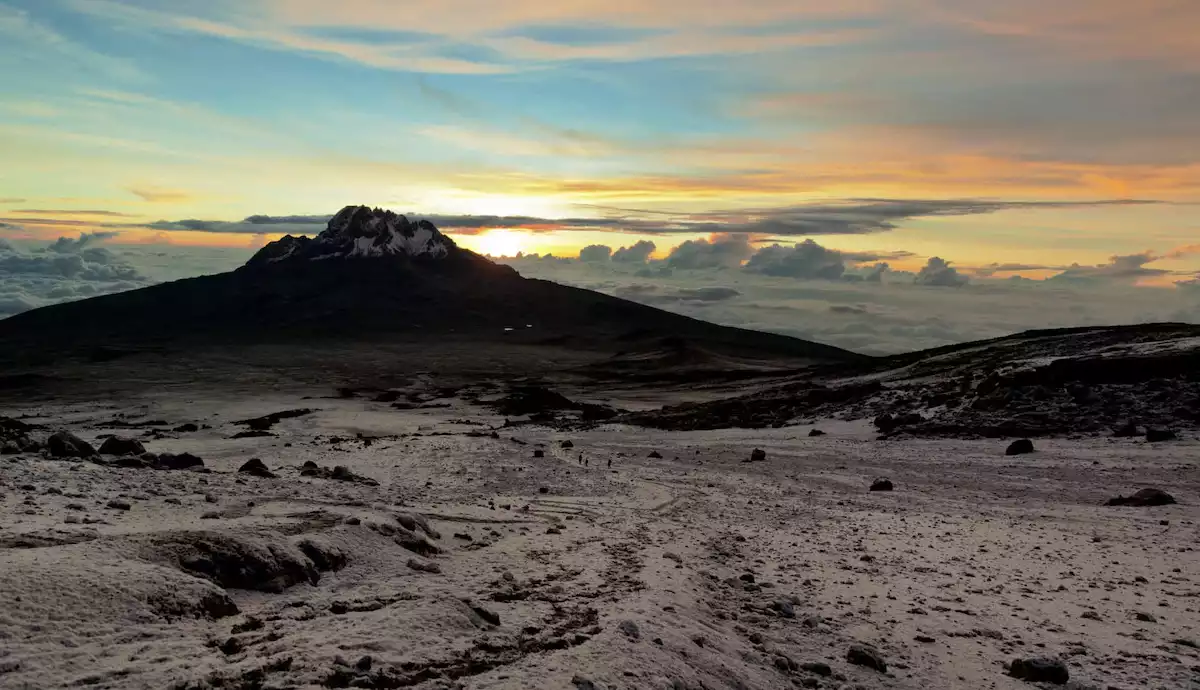 Hikers ascending the 6-Day Kilimanjaro Machame Route, surrounded by stunning landscapes.