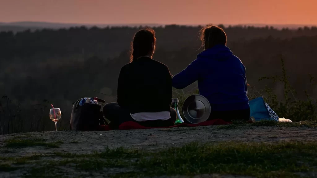 A romantic couple on a Tanzania honeymoon safari, surrounded by the beauty of the African wilderness.