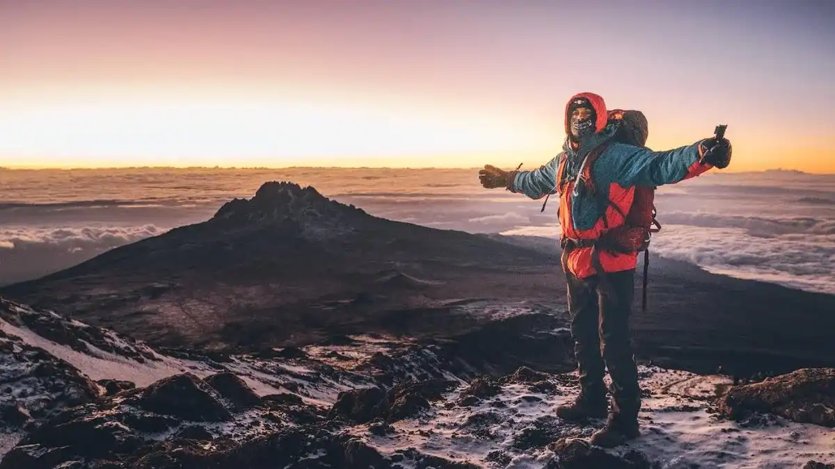 Climbers Celebrating Summit Success with Kilimanjaro Travel Advice