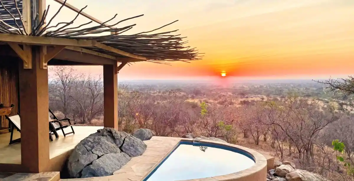 A scenic view of Kichaka Expedition Camp surrounded by the wilderness of Ruaha National Park, offering unforgettable Safari Excursions.