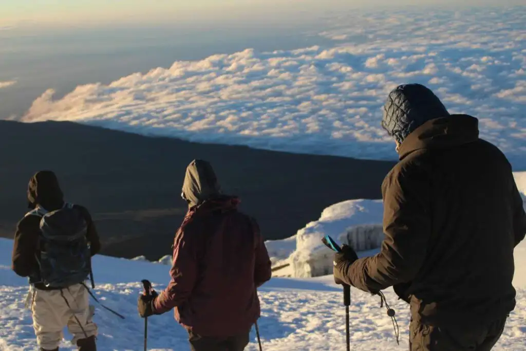 Hikers trekking the 6-Day Kilimanjaro Rongai Route, surrounded by breathtaking scenery.