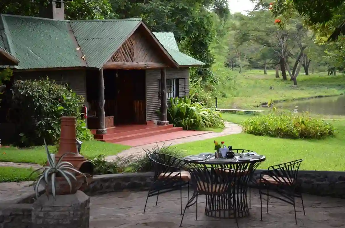 Accommodation near Mount Meru: A tranquil scene at Mount Meru Game Lodge surrounded by lush greenery.