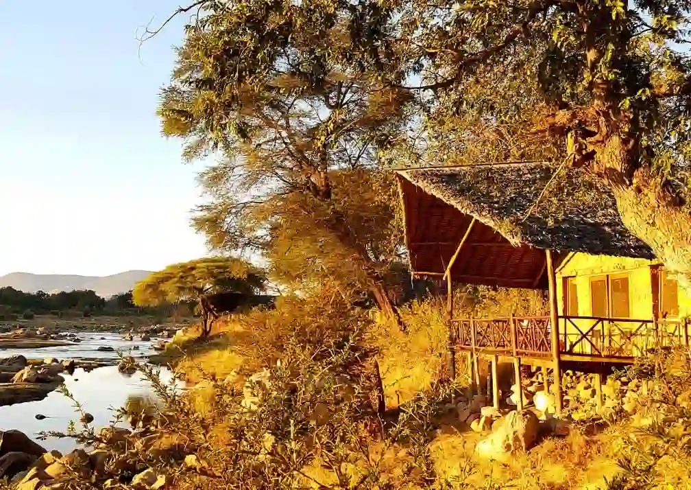 A scenic view of Ruaha River Lodge accommodations nestled in Ruaha National Park, ideal for a memorable safari experience.