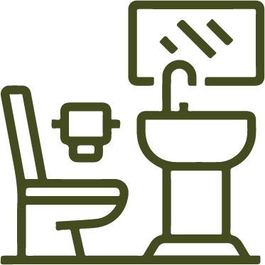 Majestic Encounter: African Safaris - Lion in Tanzania's Wilderness Serengeti Wilderness Camp Accommodation showcases elegant en-suite bathrooms with modern amenities.