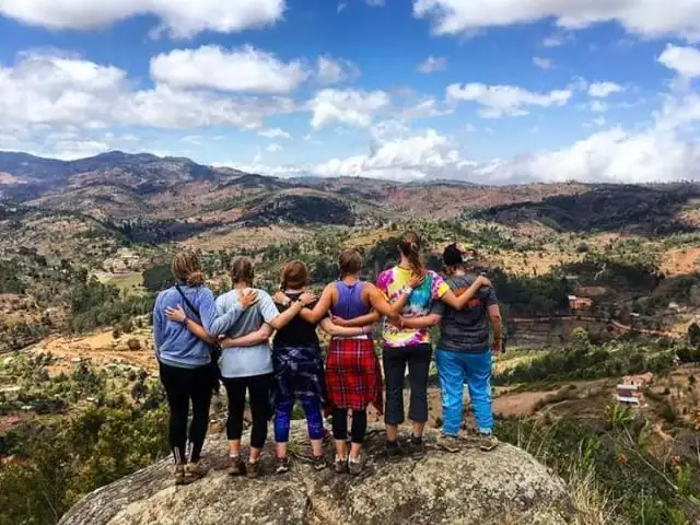 A person trekking amidst the lush greenery of the Usambara Mountains, captured in a moment of adventure and exploration.