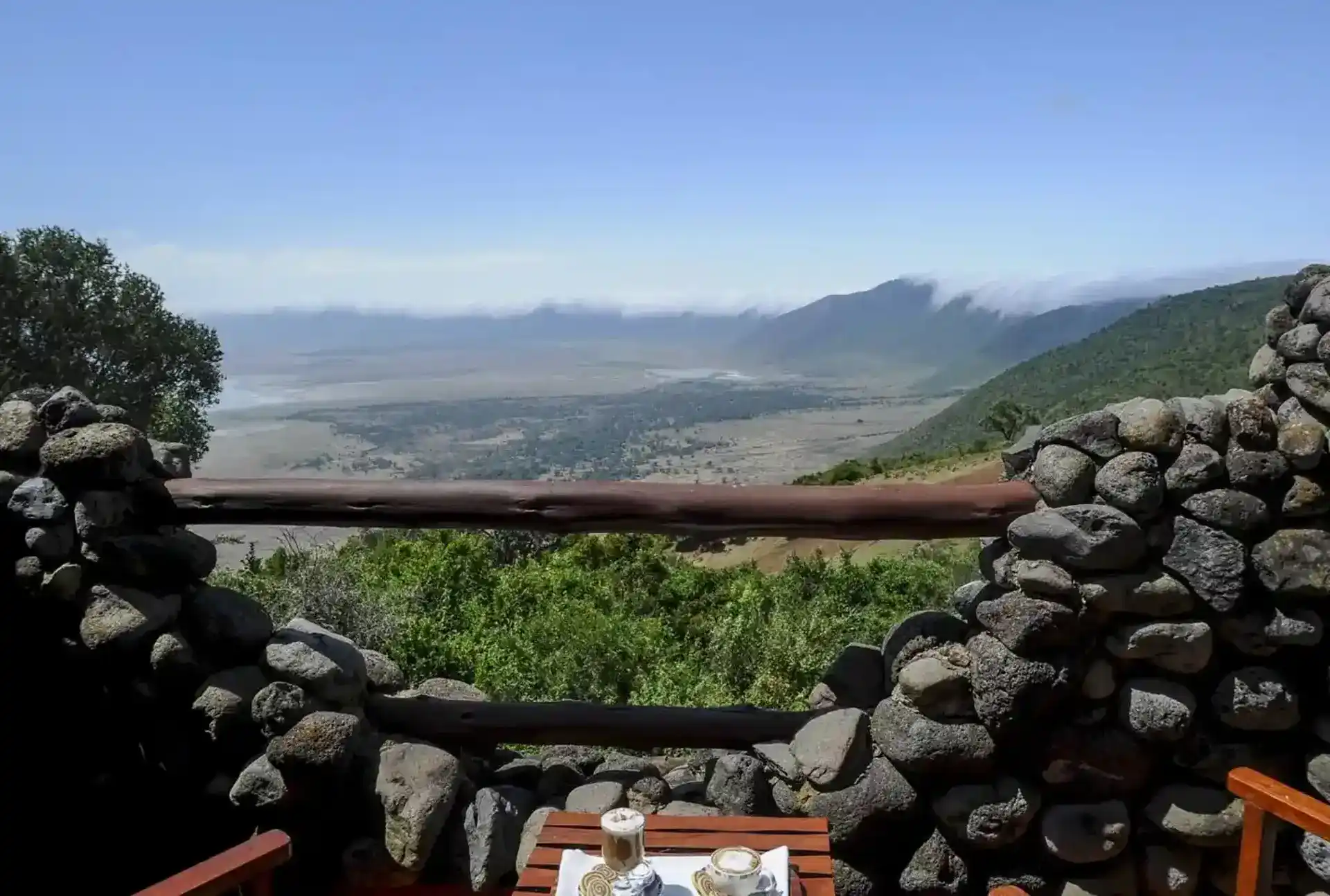 Majestic Encounter: African Safaris - Lion in Tanzania's Wilderness Enjoy breathtaking views from the balcony of Ngorongoro Serena Lodge Accommodation.