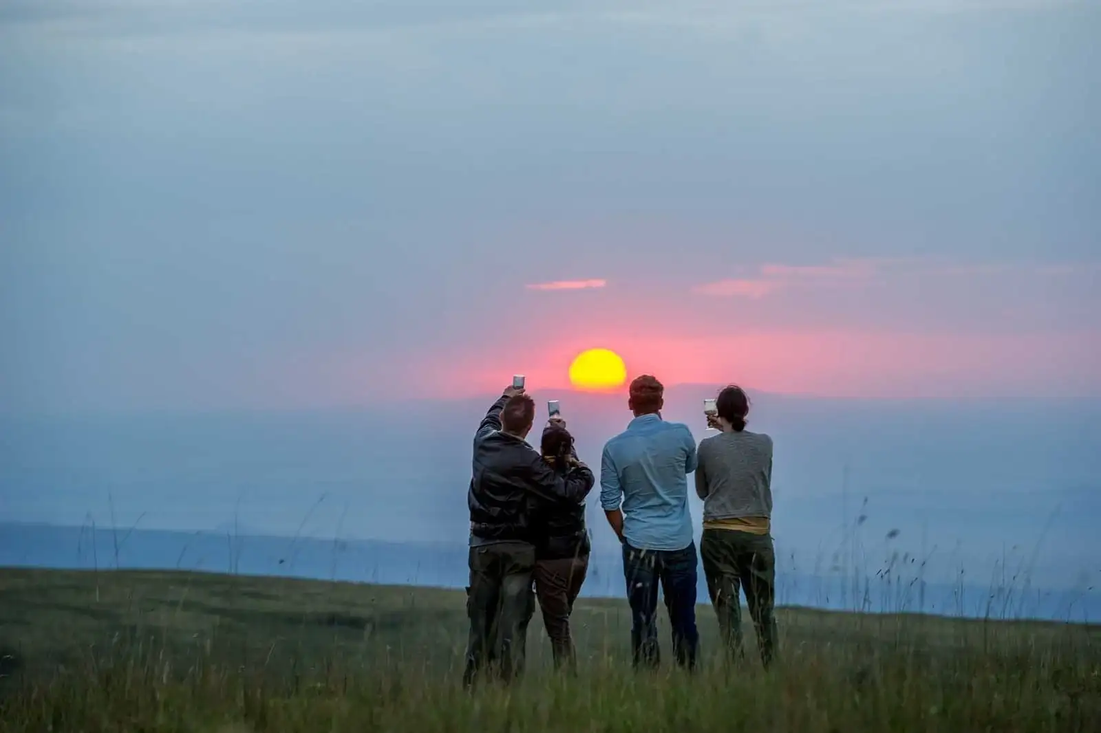 A breathtaking sunrise over Ngorongoro Serena Safari Lodge, showcasing the tranquil beauty of the accommodation nestled amidst the wilderness.