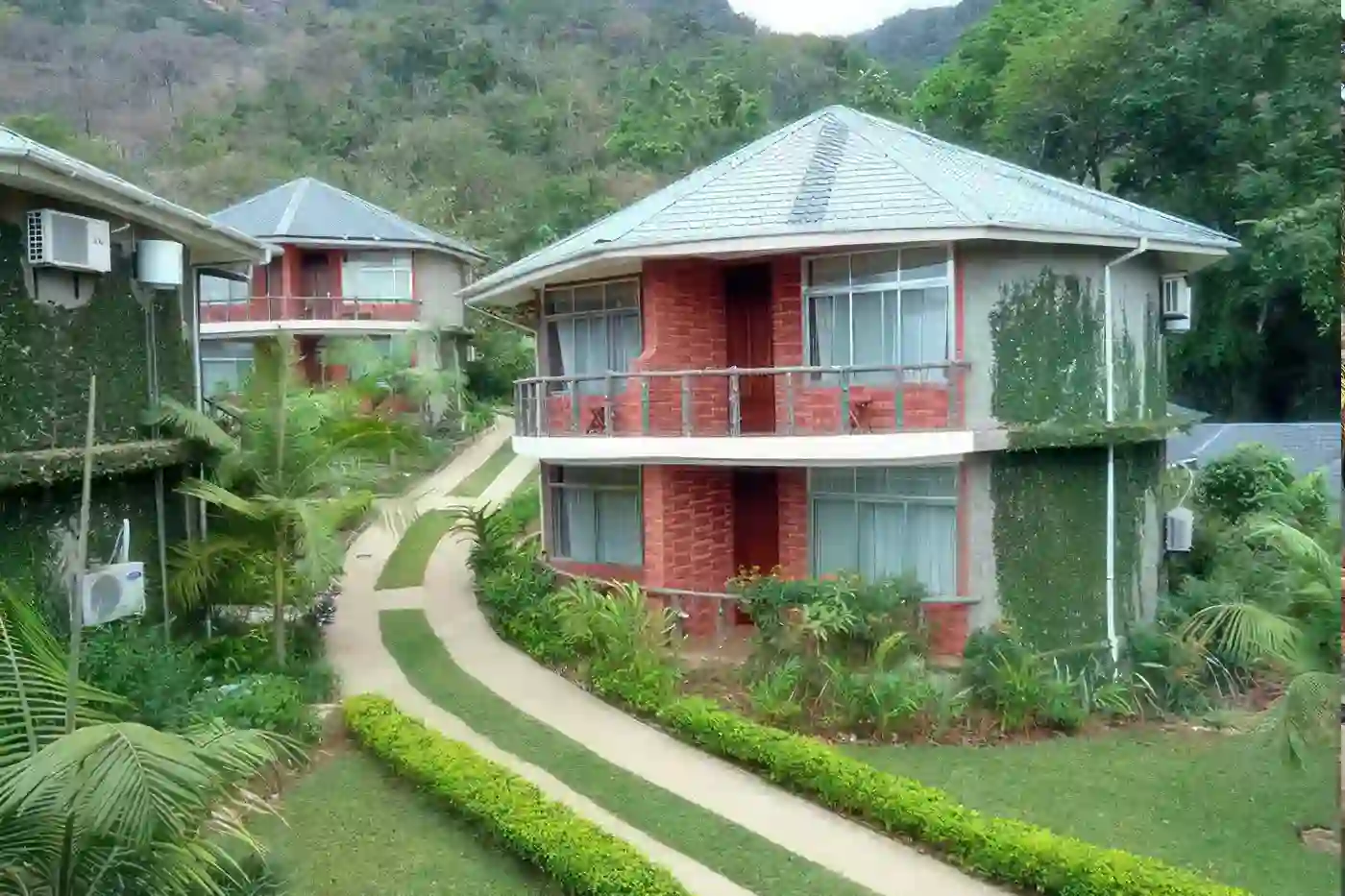 Best time for Udzungwa Mountains: Udzungwa Falls Lodge amidst lush greenery and cascading waterfalls in Udzungwa Mountains National Park.