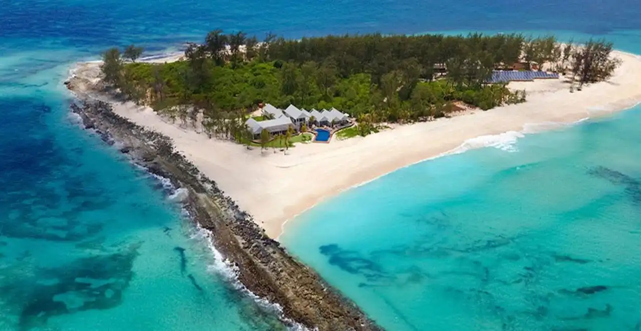 A mesmerizing view of the crystal-clear waters surrounding Mafia Island, Tanzania - the perfect destination for travelers seeking adventure and tranquility. "Why go to Mafia Island - Mafia Island, Tanzania" is your answer to an unforgettable getaway.