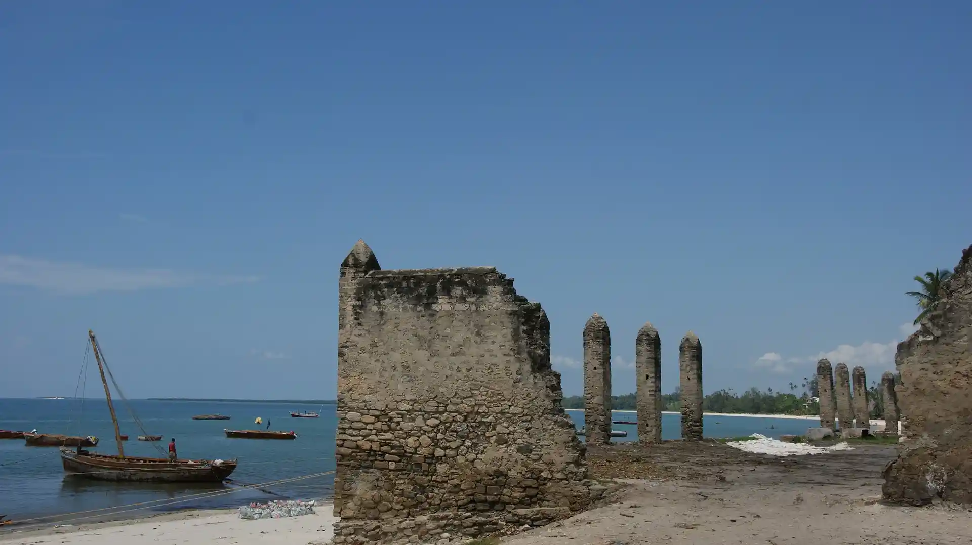A serene beach scene in Bagamoyo, Tanzania, showcasing the tranquil beauty of the coastal town. Experience Bagamoyo's captivating shores.