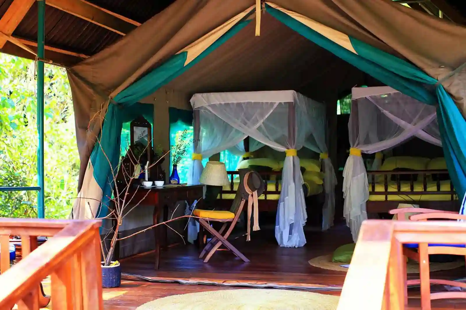 A cozy tent nestled in the lush greenery of Gombe Forest Lodge, an ideal base for exploring Gombe Stream National Park. When to Visit Gombe National Park.