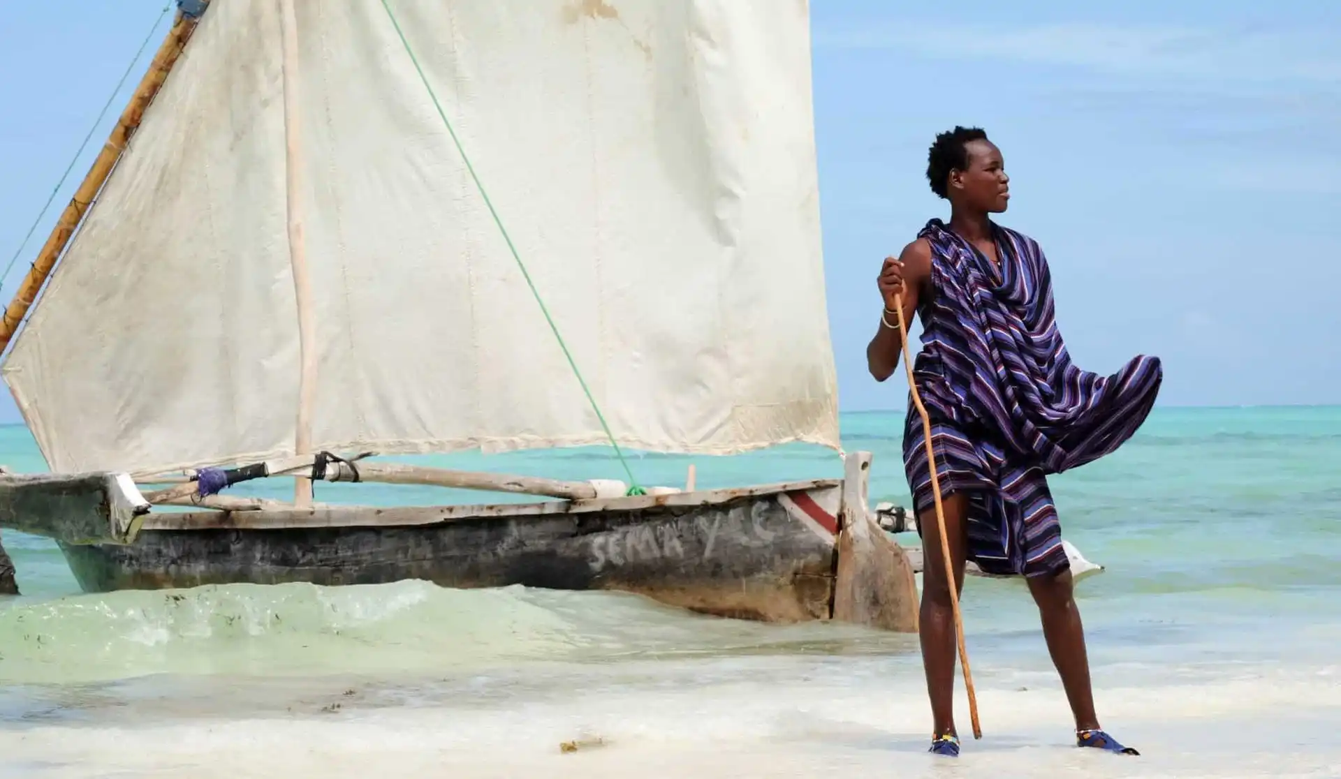 A vibrant image showcasing the allure of Zanzibar's beaches, inviting you to explore its Maasai cultural tours and traditional dhow journeys.